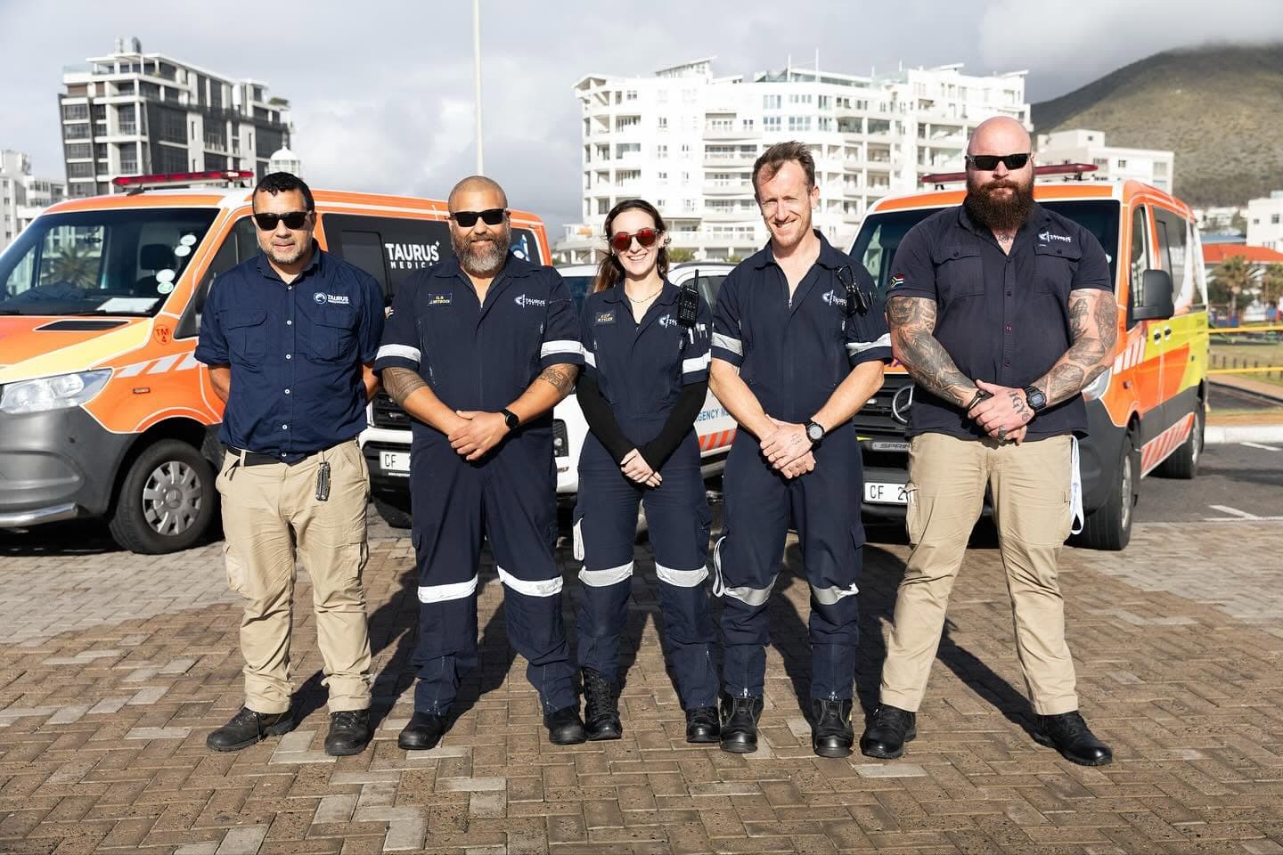 The Taurus Medical crew in front of their ambulance fleet in Cape Town